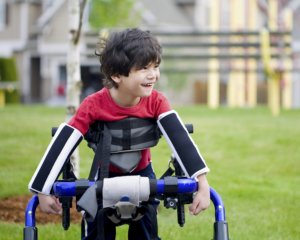 happy boy in wheelchair